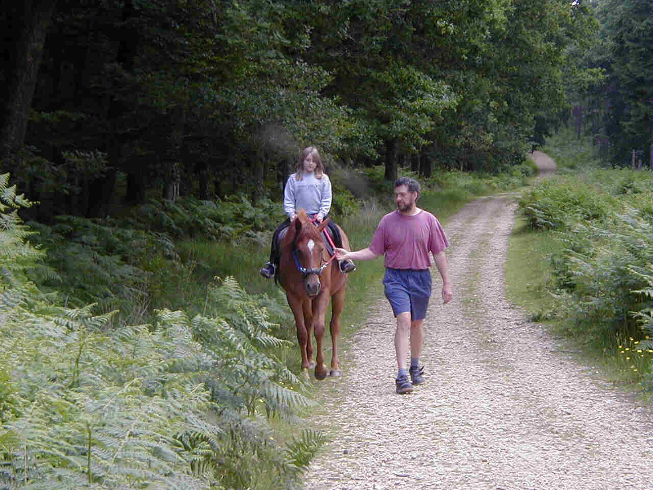 Eleanor riding Holly, led by Richard